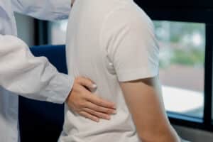 Back pain when sitting, upper cervical chiropractor in Vancouver WA, sitting back pain relief, back pain from long drives, spinal misalignment and back pain, NUCCA chiropractor in Vancouver WA